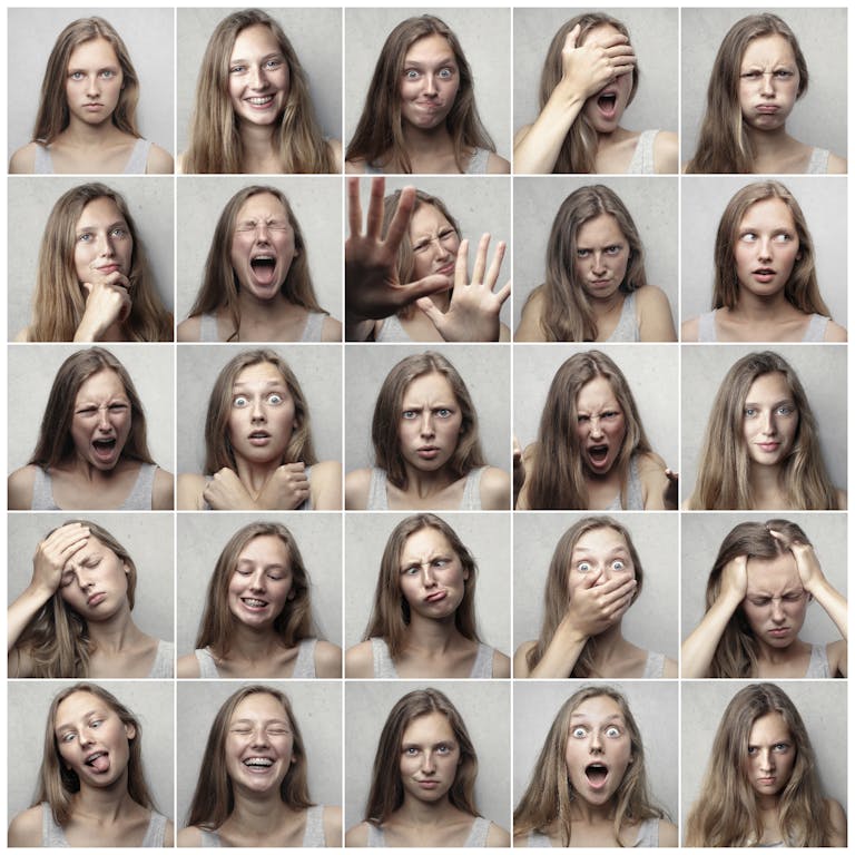 Multiple portraits showcasing various facial expressions and emotions of a young woman.